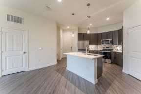 Spacious Full Size Kitchen with pendant lights at Residences at 3000 Bardin Road, Grand Prairie, TX, 75052