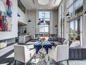 a living room filled with furniture and a large window at Republic at Alamo Heights, San Antonio Texas