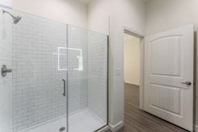 Designer Bathroom Suites with a shower at Residences at 3000 Bardin Road, Grand Prairie, TX