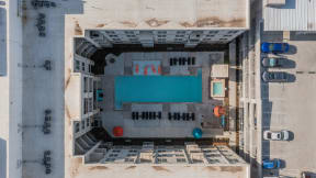 an aerial view of a building with a blue pool at Residences at 3000 Bardin Road, Grand Prairie, TX