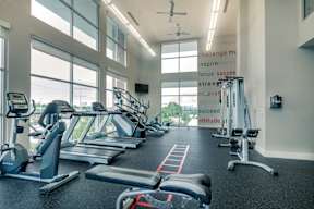 a gym with treadmills and other exercise equipment at Republic at Alamo Heights, Texas, 78209