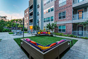 an outdoor lounge area at the bradley braddock road station apartments at Republic at Alamo Heights, San Antonio Texas