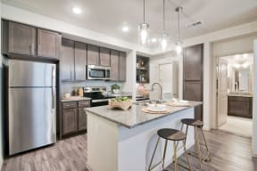 Gourmet Kitchen With Island at Seville at Clay Crossing, Katy, Texas