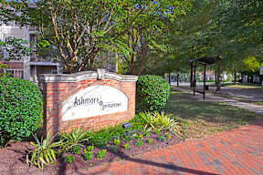 A sign that says Ashmore Germantown is in front of a building.