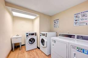 A laundry room with a washer and dryer.