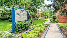 A blue sign at Eagles Crossing Apartments, Washington, DC