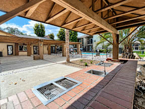 A building with a wooden roof and a brick walkway.