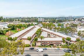 A large building with a parking lot in front of it.