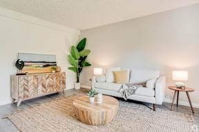 a living room with a couch and a coffee table at University Park, Azusa California