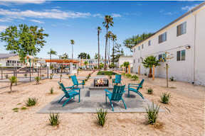 an outside patio with chairs and a fire pit at Sunnymead Apts Apartments, Moreno Valley, 92553