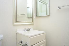 a bathroom with a sink and a mirror  at Villa Hemet, Hemet, CA 92543