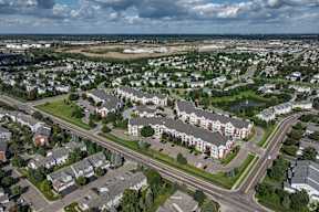 A suburban area with a mix of residential and commercial buildings.