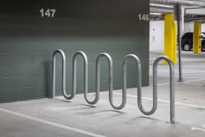 a row of bike racks in a parking garage
