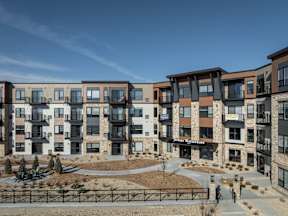 A large apartment complex with a courtyard in the middle.