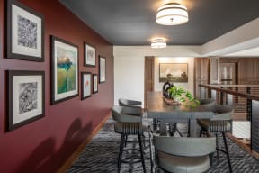 a rendering of a dining room with a table and chairs