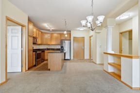 a view of a living room and kitchen