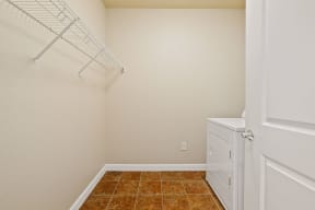 a laundry room with a washer and dryer