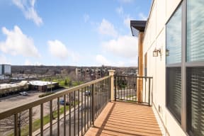a balcony with a view of a parking lot