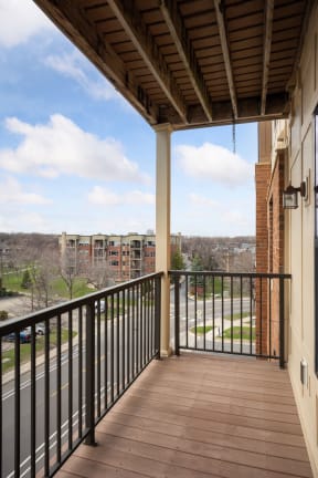 a balcony with a view of the city