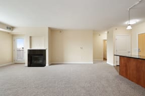 a spacious living room with a fireplace