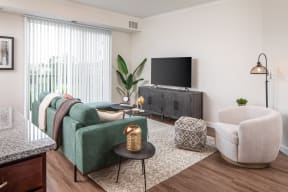 a living room with a couch and a tv