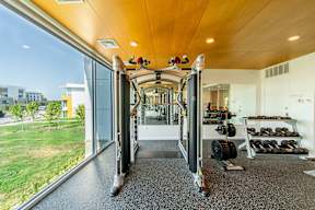 A gym with a view of the outside.