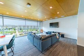 A conference room with a long table and chairs.