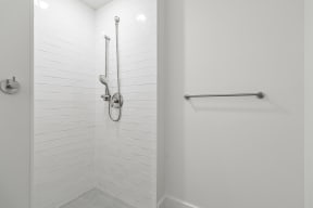 Bathrooms with custom quartz countertops and large soaking tubs at G at Market in Bentonville, AR