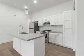 Large open kitchens with custom quartz countertops at G at Market in Bentonville, AR
