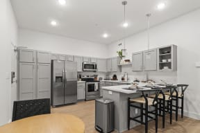 Large open kitchens with custom quartz countertops at G at Market in Bentonville, AR