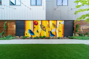 Private Outdoor Courtyard with Yard Games, Grills and Fire Pit at G at Market in Bentonville, AR