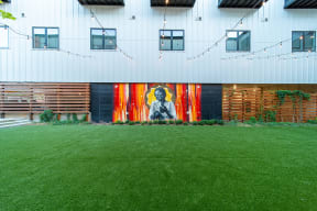 Private Outdoor Courtyard with Yard Games, Grills and Fire Pit at G at Market in Bentonville, AR