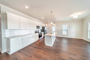 Two and three-bedroom townhomes featuring premium appliances, LVT flooring, garages, custom countertops, custom cabinetry and more at Hawthorne Grove in Rogers, AR