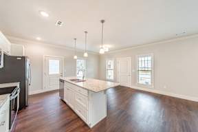 Two and three-bedroom townhomes featuring premium appliances, LVT flooring, garages, custom countertops, custom cabinetry and more at Hawthorne Grove in Rogers, AR