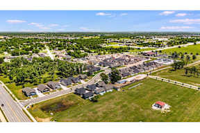 Two and three-bedroom townhomes featuring premium appliances, LVT flooring, garages, custom countertops, custom cabinetry and more at Hawthorne Grove in Rogers, AR