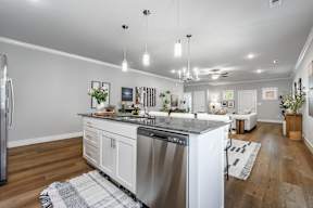 Two and three-bedroom townhomes featuring premium appliances, LVT flooring, garages, custom countertops, custom cabinetry and more at Hawthorne Grove in Rogers, AR