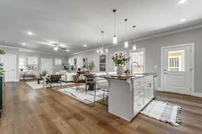 Two and three-bedroom townhomes featuring premium appliances, LVT flooring, garages, custom countertops, custom cabinetry and more at Hawthorne Grove in Rogers, AR