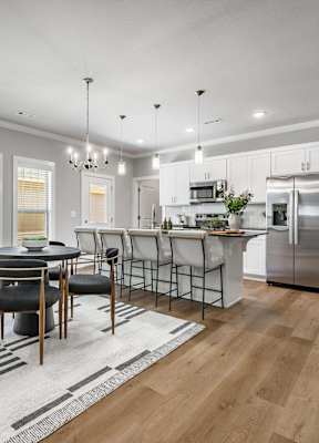 Two and three-bedroom townhomes featuring premium appliances, LVT flooring, garages, custom countertops, custom cabinetry and more at Hawthorne Grove in Rogers, AR