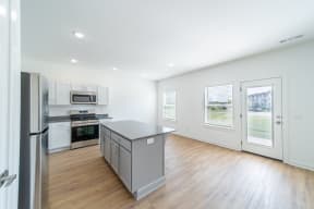 Kitchen with stainless steel appliances at Shadowbrooke Village in Rogers, AR