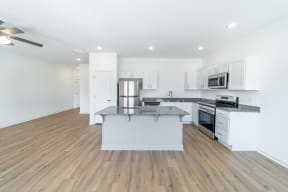 Spacious kitchen with modern lighting at Shadowbrooke Village in Rogers, AR