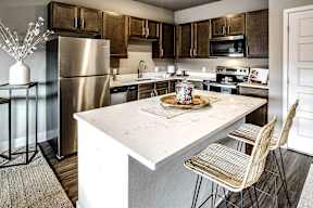 kitchen with stainless steel appliances at Sterling at Prairie Trail in Ankeny, IA