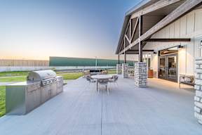 Community lounge with grilling station at The Boulevard in Joplin, MO