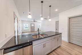 Kitchen with stainless steel appliances at The Grove in Rogers, AR