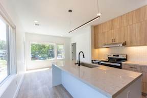 Studio, one and two bedroom apartment homes at The Howard East Central in Bentonville, AR