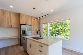 Studio, one and two bedroom apartment homes at The Howard East Central in Bentonville, AR