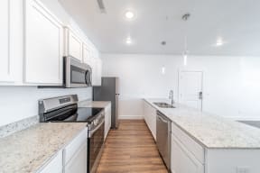 Ktichen with stainless steel appliances  at The Benton in Pea Ridge, AR
