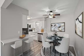 an open kitchen and dining room with a table and chairs