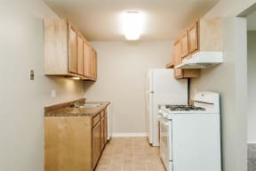 Fully Furnished Kitchen at Residences at Grand Blanc Apartments - Grand Blanc, MI, Michigan