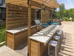 Be @ Axon Green  Grill Area with Granite Counter Tops and Bar stools