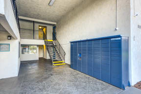 the Amazon lockers in the office lobby next to a staircase